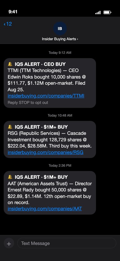 Three IQS insider-buy alerts arriving as text messages on a phone